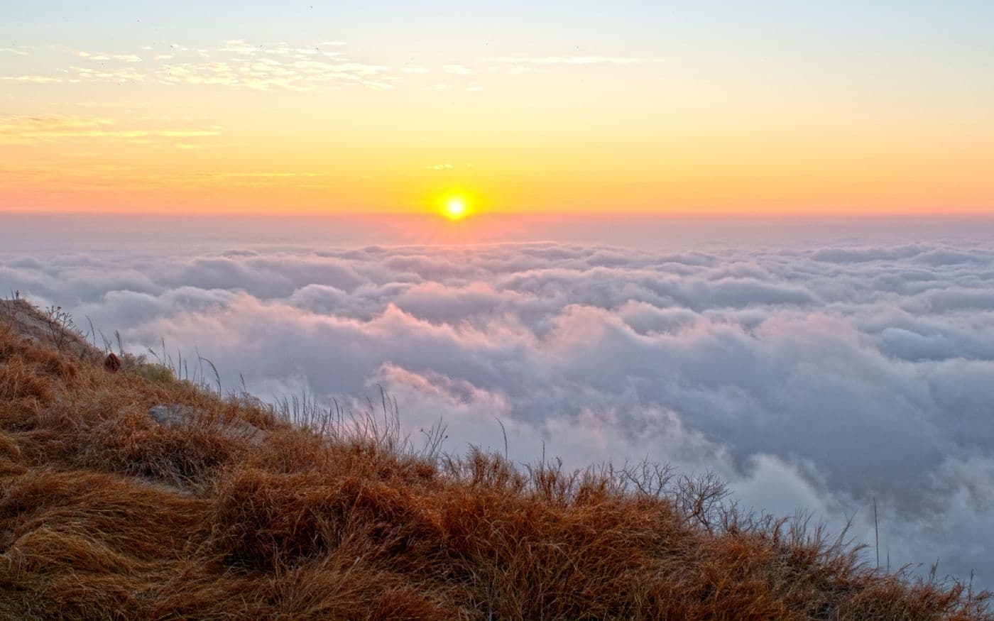 Sunrise above the cloud line at Nandi Hills, north of Bengaluru