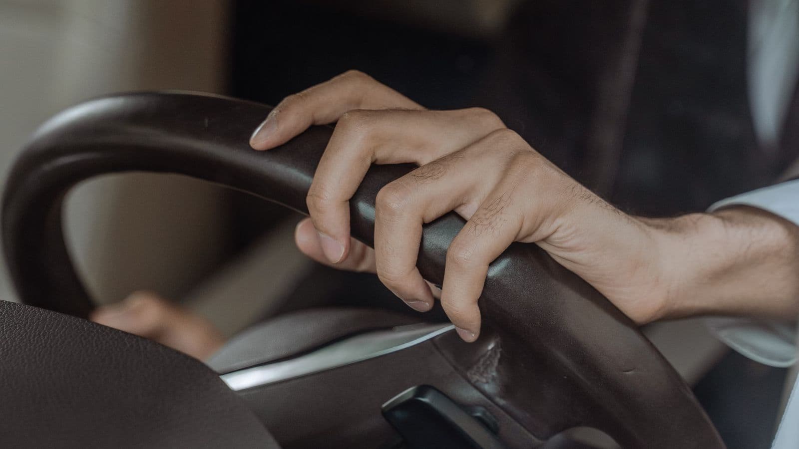 A trained chauffeur at the wheel of a customer's own car