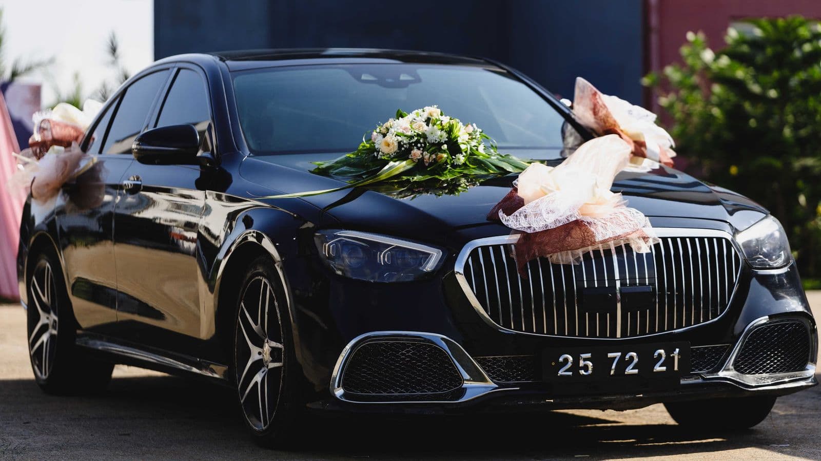 A chauffeur-driven luxury car for a wedding or executive pickup